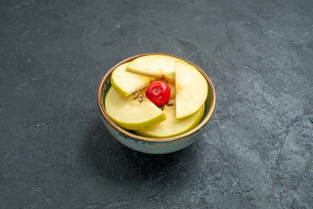 Front view fresh sliced apples inside little pot on grey background fresh fruit mellow ripe