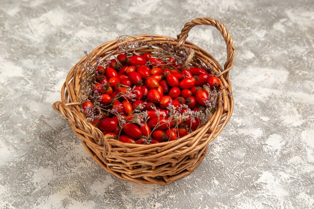 Front view fresh sour dogwoods inside basket on white desk