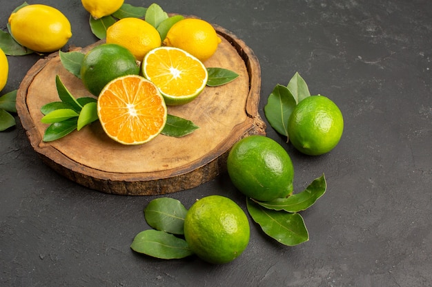 Front view fresh sour lemons on dark background