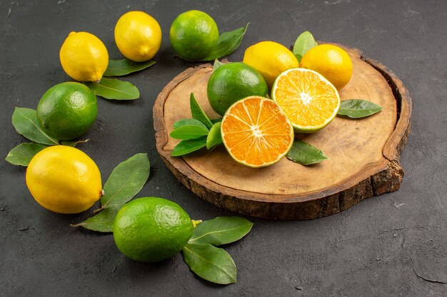 Front view fresh sour lemons on dark background