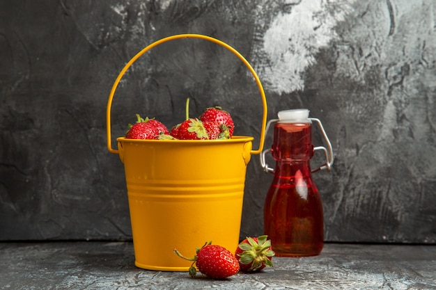 Front view fresh strawberries inside basket on a dark background