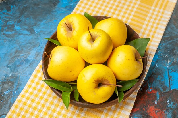 Front view fresh sweet apples inside plate on a blue background health diet  ripe tasty mellow