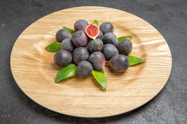 Front view fresh sweet figs inside plate on dark background