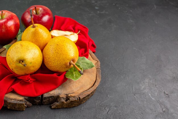 Front view fresh sweet pears with apples on dark table fresh color ripe mellow