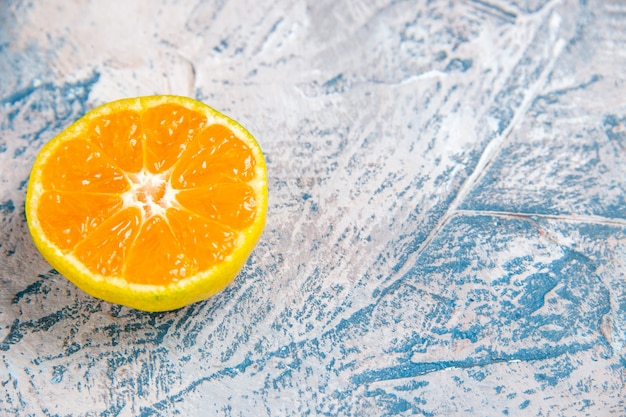 Front view fresh tangerine slice on a light-blue table