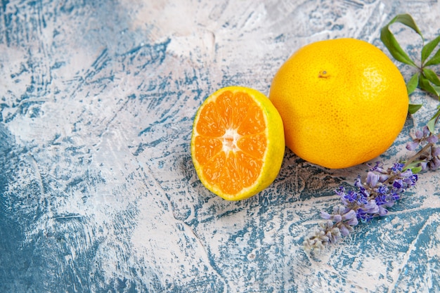 Front view fresh tangerine slice on a light-blue table