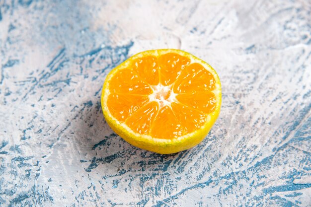 Front view fresh tangerine slice on light-blue table