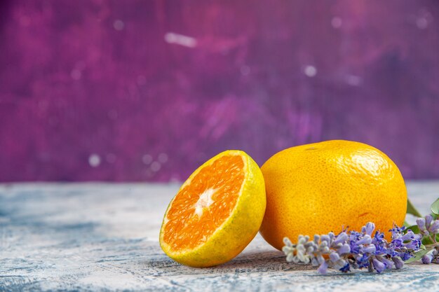 Front view fresh tangerine slice on pink-blue table