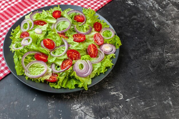 Front view fresh vegetable salad with onions green salad and tomatoes on gray background health photo color ripe salad food diet meal