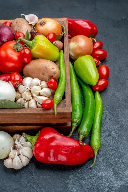 Front view fresh vegetables composition on the grey table ripe salad fresh color