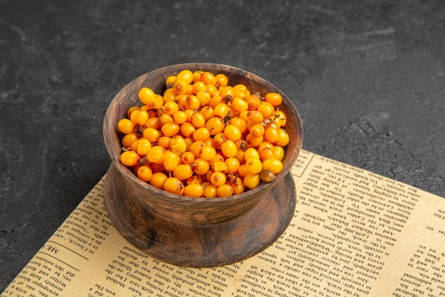 Front view fresh yellow berries on dark background