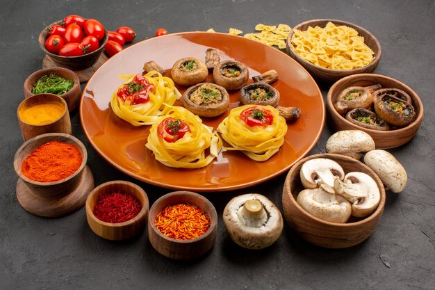 Front view fried mushrooms with seasonings on dark grey table meal food dinner