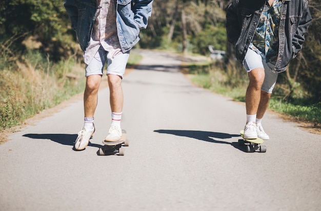 Front view of friends skateboarding