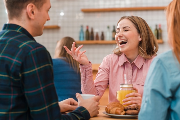 Free photo front view of friends spending time together