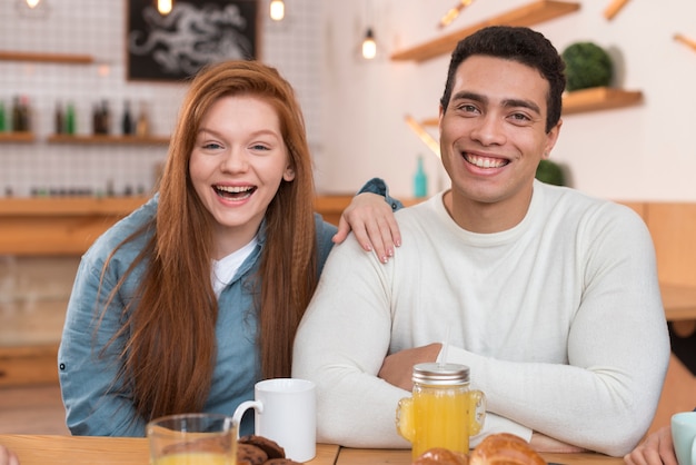 Front view of friends at table