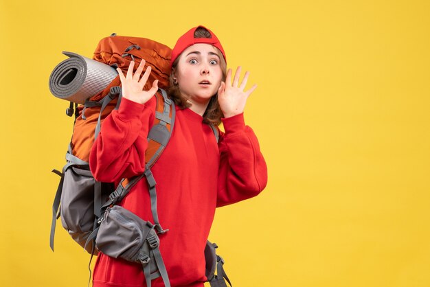 Front view frightened traveller woman in red backpack