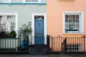 Free photo front view of front door with blue and orange wall