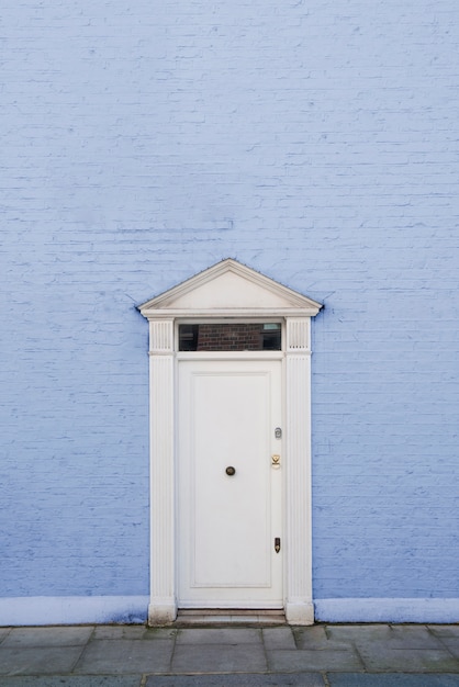 Front view of front door with blue wall