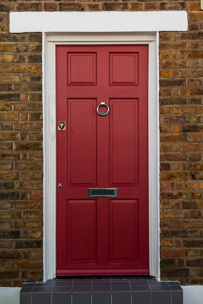 Front view of front door with brown wall