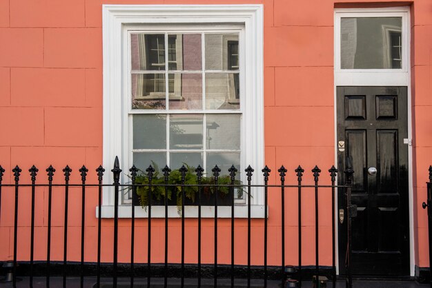 Front view of front door with orange wall