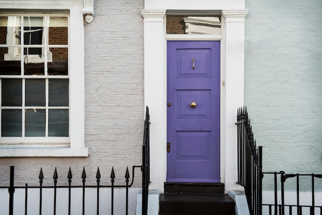 front view of front door with white and blue wall