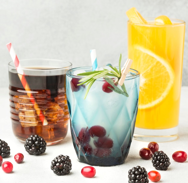 Front view of fruit cocktail glasses with straws