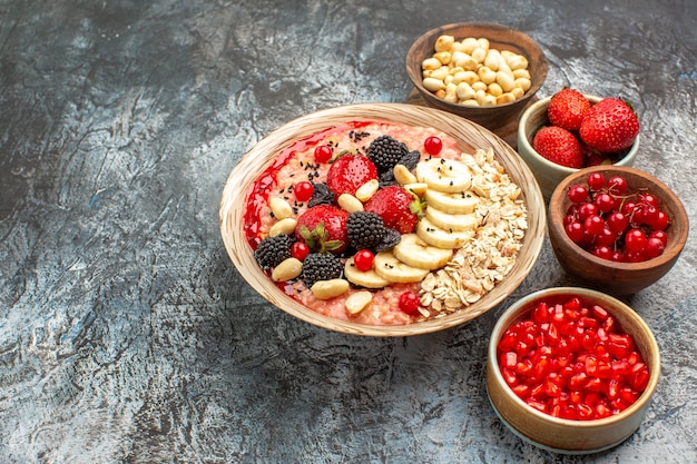 Front view fruity muesli with fruits and nuts on light table fruit health cereal