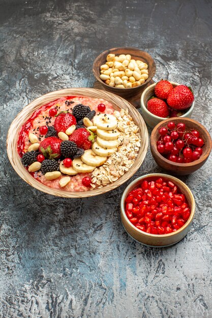 Front view fruity muesli with fruits and nuts on light table fruits health cereal