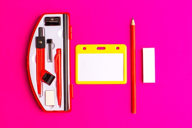 Front view geometric figures with pencil on the purple surface