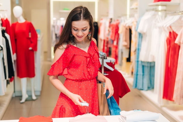 Front view girl checking prices