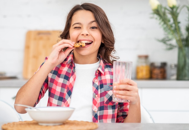 Front view girl enjoying breakfast