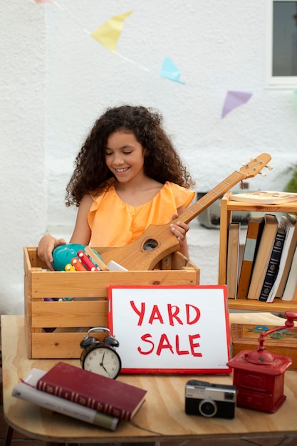 Free photo front view girl at garage sale