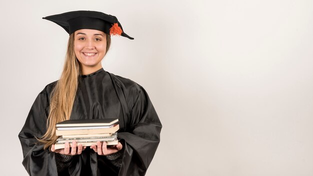 Front view girl graduating with copy space