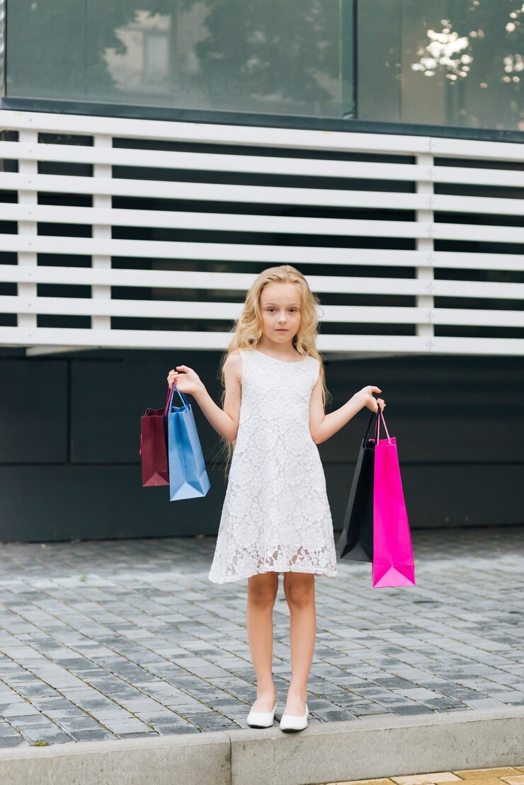 Free Photo front view girl holding shopping bags