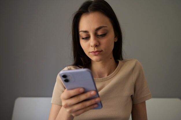 Front view girl holding smartphone