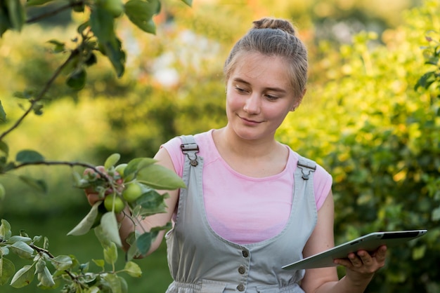 Front view girl holding tablet