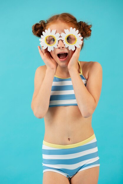 Front view girl posing with sunglasses