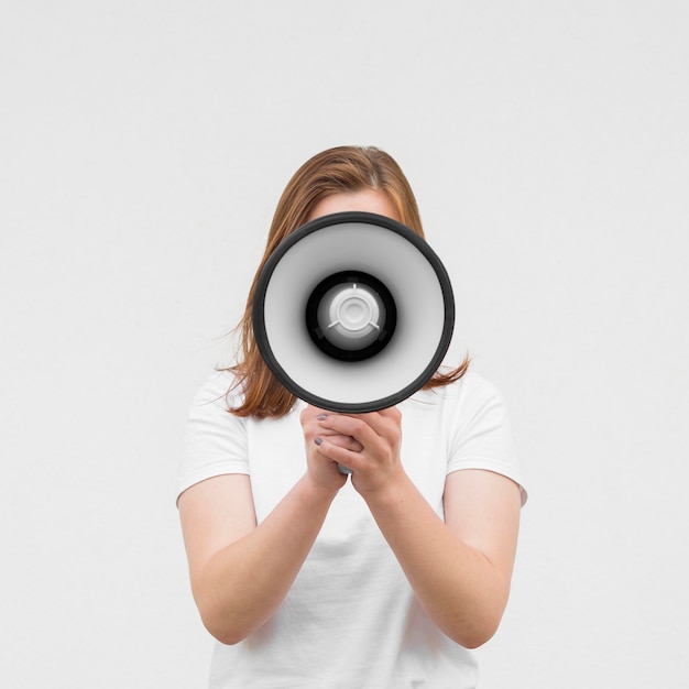 Front view girl screaming in megaphone