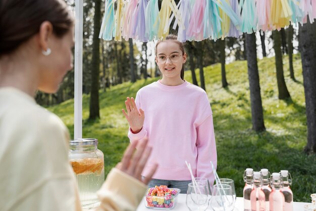 Front view girl selling lemonade