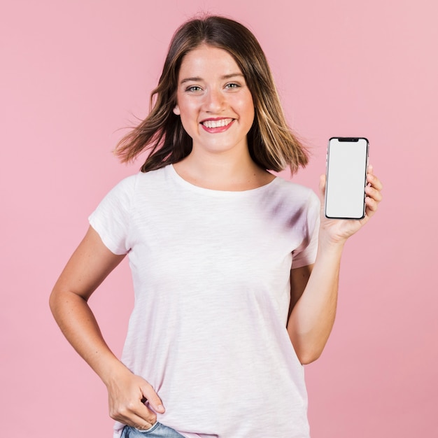 Free photo front view girl showing her phone