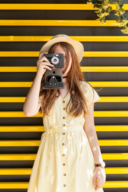 Front view girl taking photos