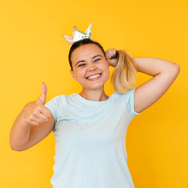 Front view of girl wearing a crown concept