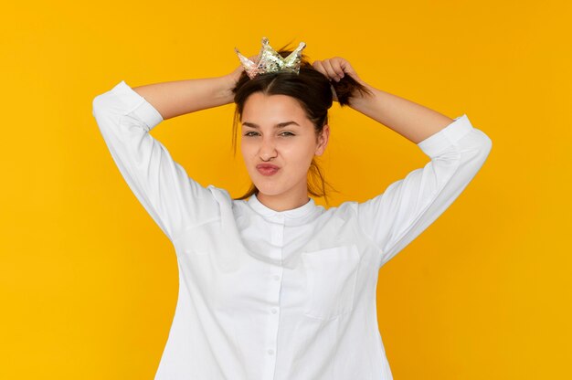 Front view of girl wearing a crown concept