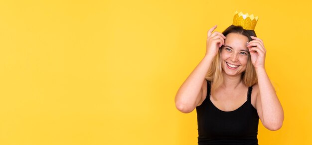 Front view of girl wearing a crown with copy space