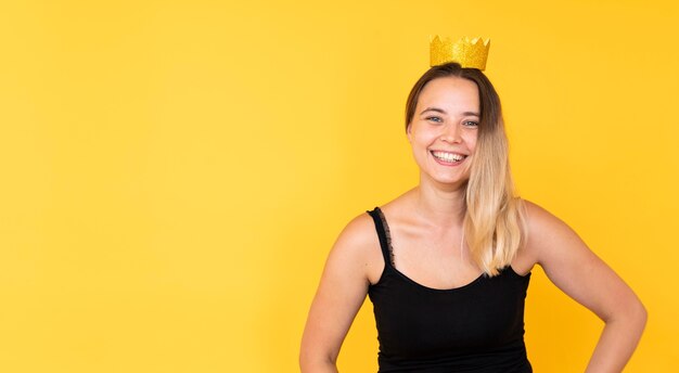 Front view of girl wearing a crown with copy space