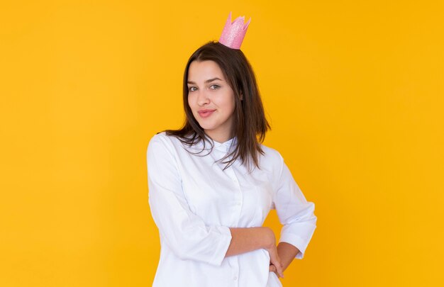 Front view of girl wearing a crown with copy space