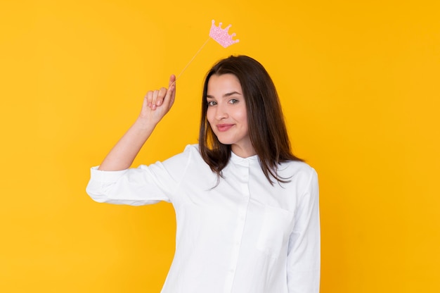 Front view of girl wearing a crown with copy space