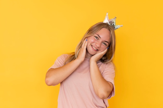 Front view of girl wearing a crown with copy space