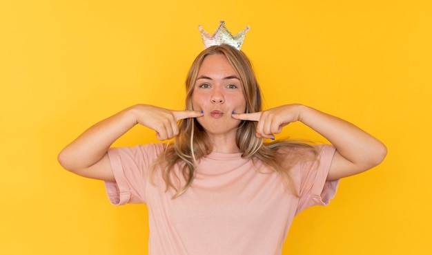 Front view of girl wearing a crown with copy space