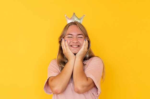 Front view of girl wearing a crown with copy space